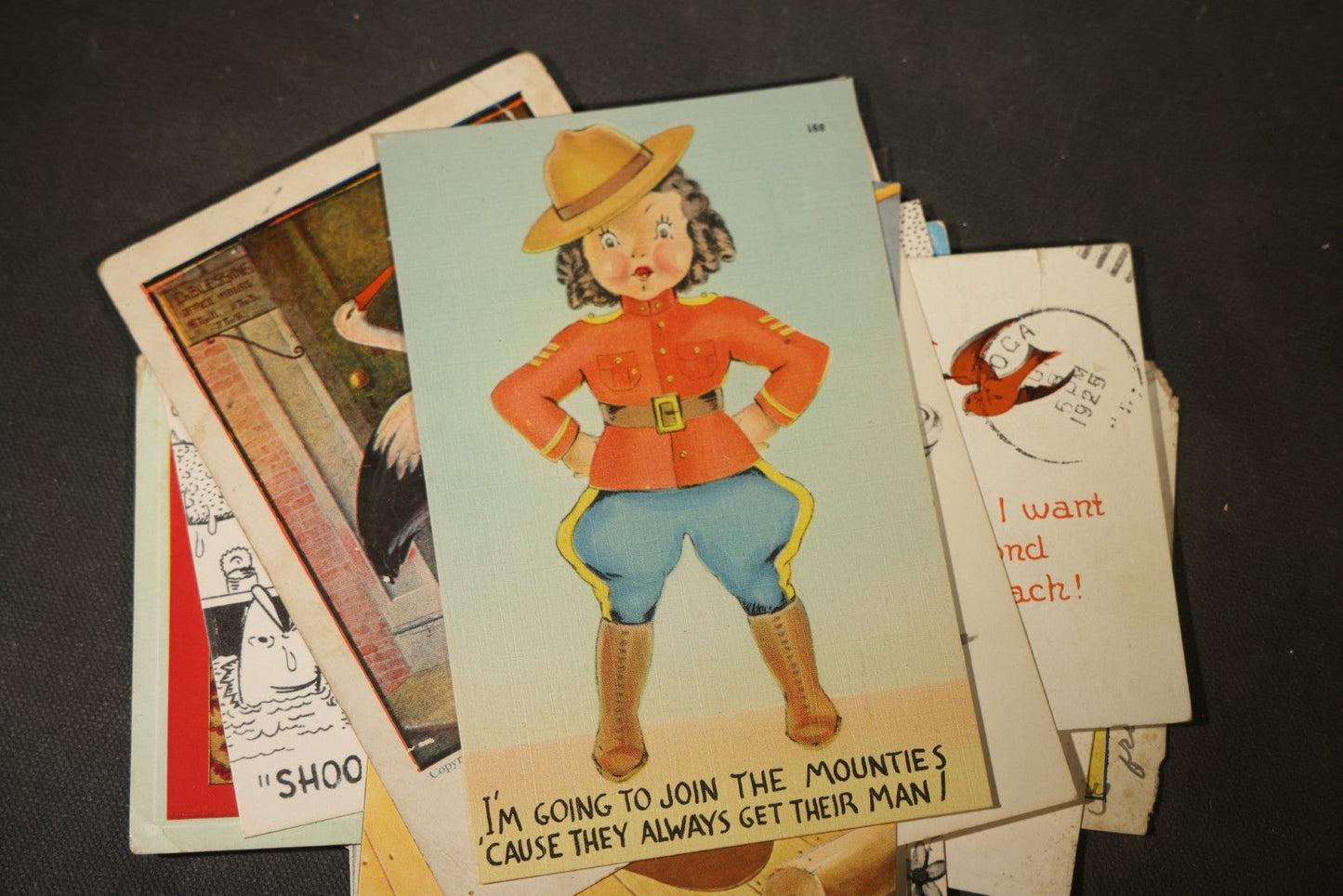 Grouping of approximately 25 Antique and Vintage Postcards including Comic, Greeting, Floral, and Holiday Subjects