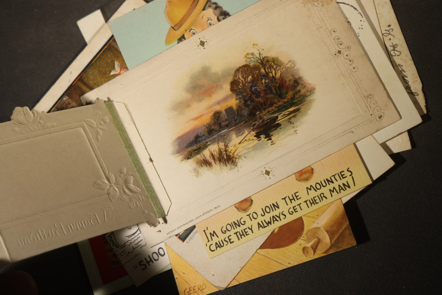 Grouping of approximately 25 Antique and Vintage Postcards including Comic, Greeting, Floral, and Holiday Subjects