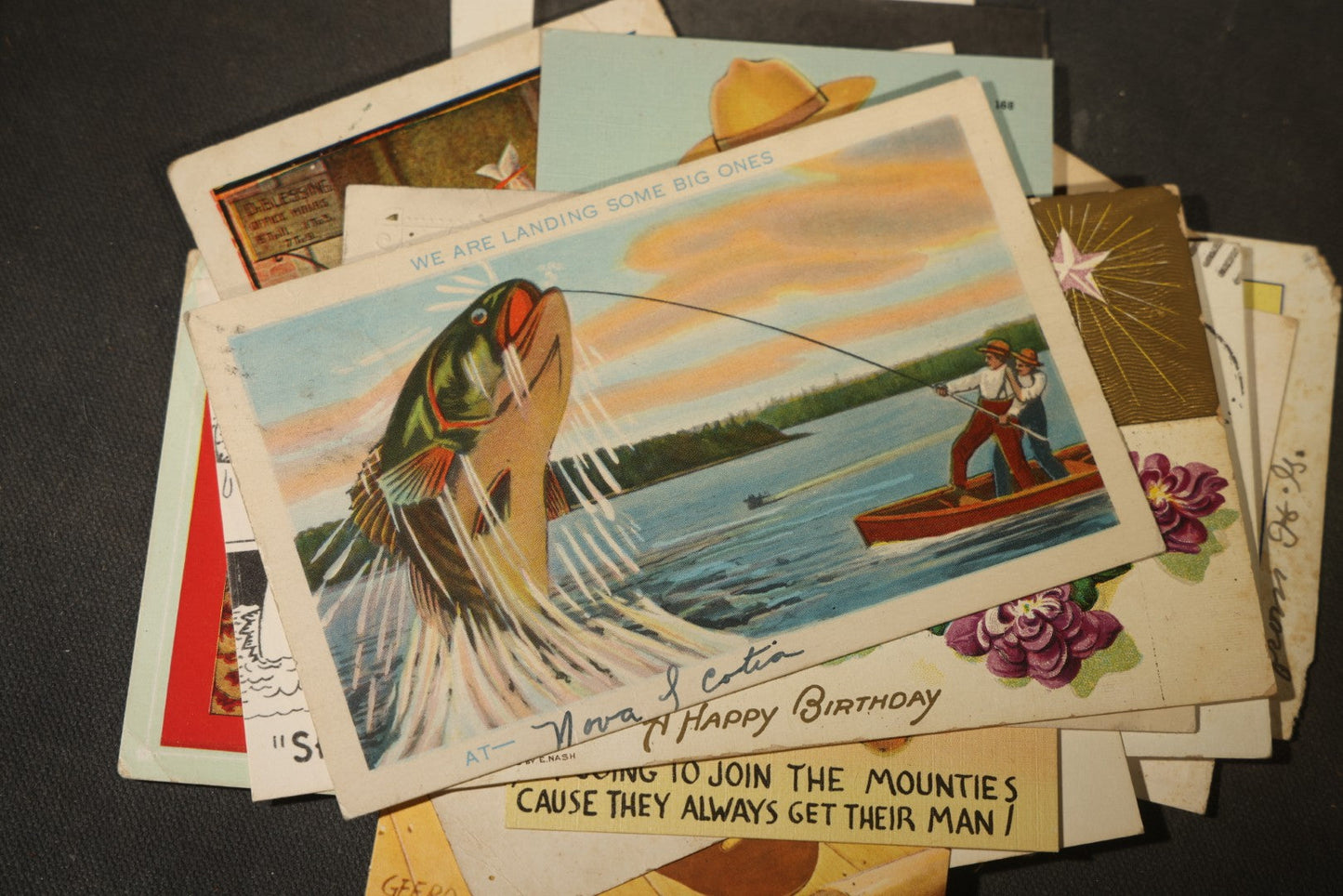 Grouping of approximately 25 Antique and Vintage Postcards including Comic, Greeting, Floral, and Holiday Subjects