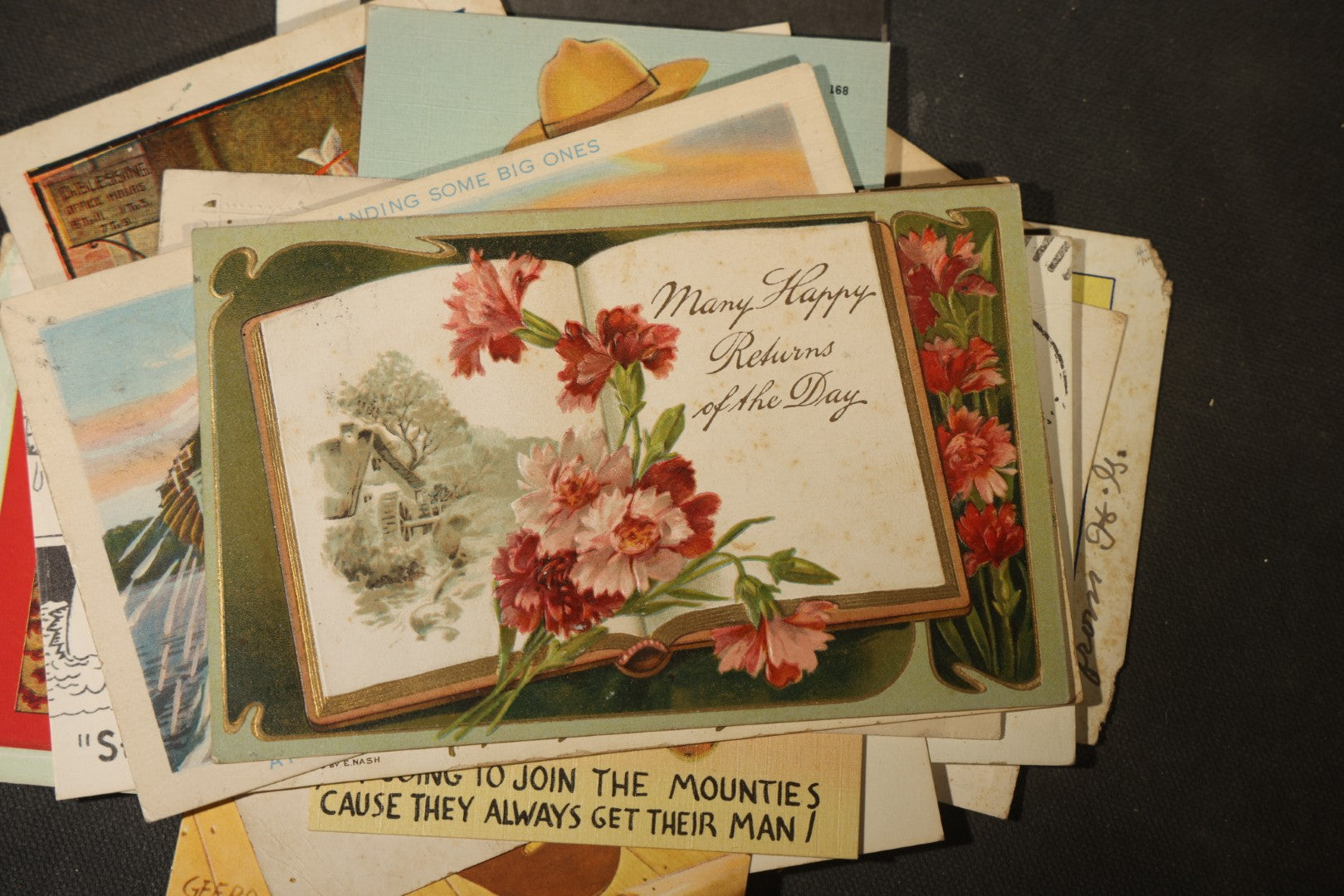 Grouping of approximately 25 Antique and Vintage Postcards including Comic, Greeting, Floral, and Holiday Subjects