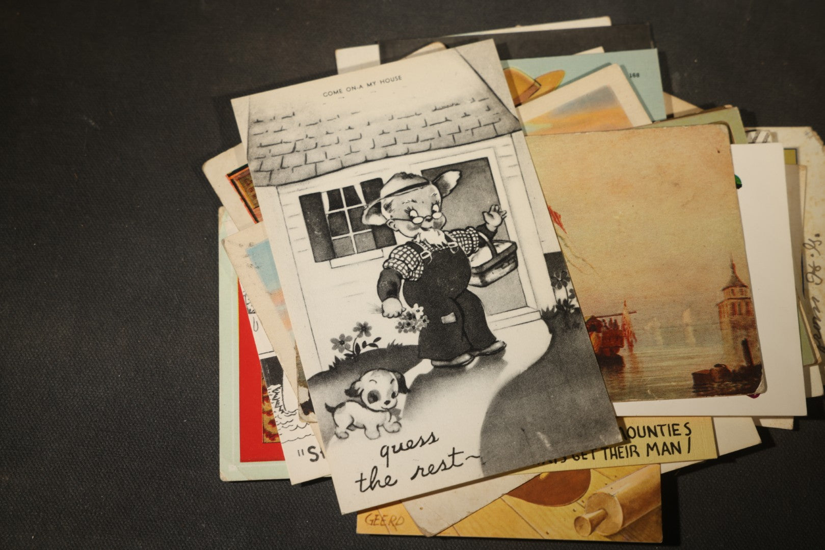 Grouping of approximately 25 Antique and Vintage Postcards including Comic, Greeting, Floral, and Holiday Subjects