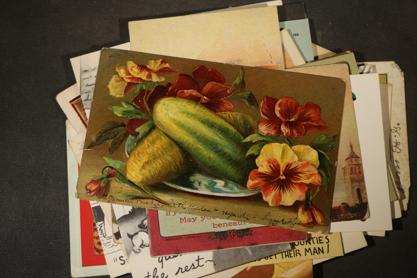 Grouping of approximately 25 Antique and Vintage Postcards including Comic, Greeting, Floral, and Holiday Subjects