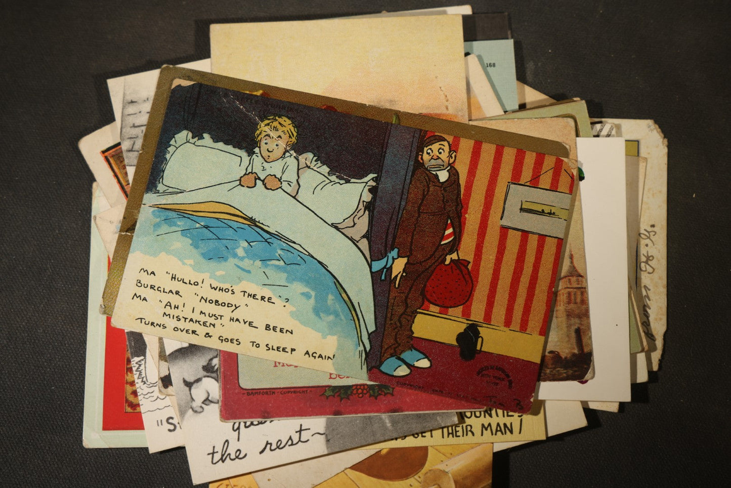 Grouping of approximately 25 Antique and Vintage Postcards including Comic, Greeting, Floral, and Holiday Subjects