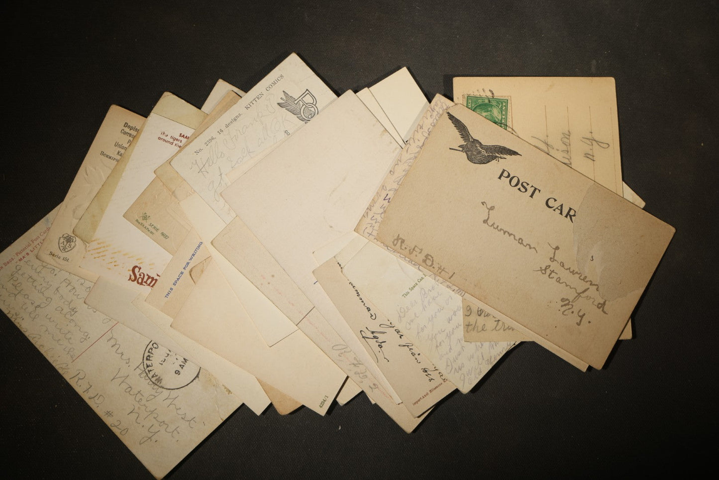Grouping of approximately 25 Antique and Vintage Postcards including Comic, Greeting, Floral, and Holiday Subjects