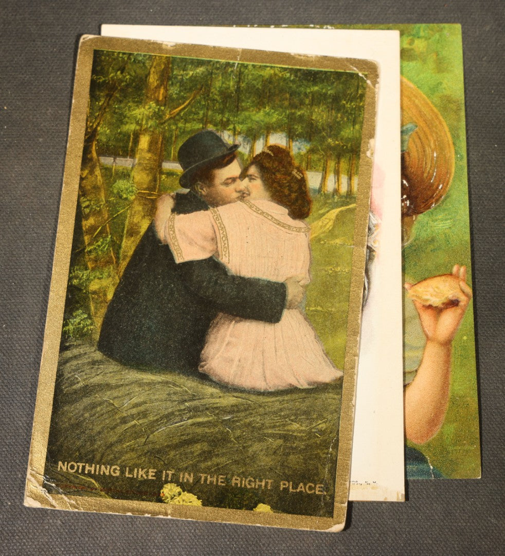 Grouping of approximately 15 Antique and Vintage Postcards including Girl with Dog, Romantic Couples, and Women's Portraits