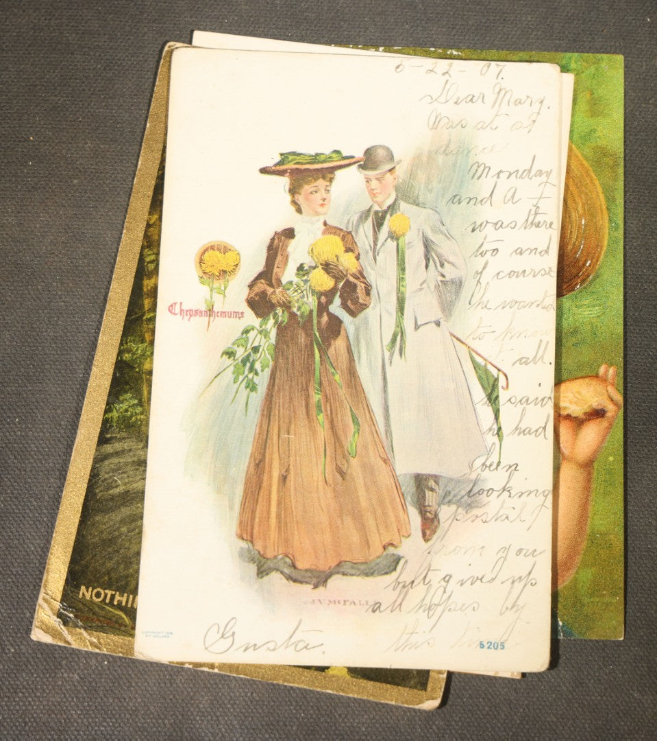 Grouping of approximately 15 Antique and Vintage Postcards including Girl with Dog, Romantic Couples, and Women's Portraits