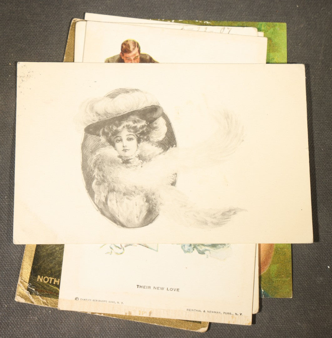 Grouping of approximately 15 Antique and Vintage Postcards including Girl with Dog, Romantic Couples, and Women's Portraits