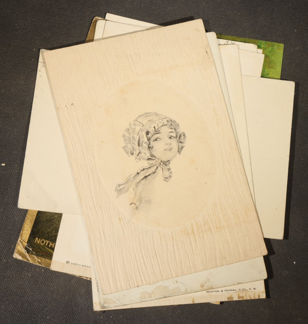 Grouping of approximately 15 Antique and Vintage Postcards including Girl with Dog, Romantic Couples, and Women's Portraits