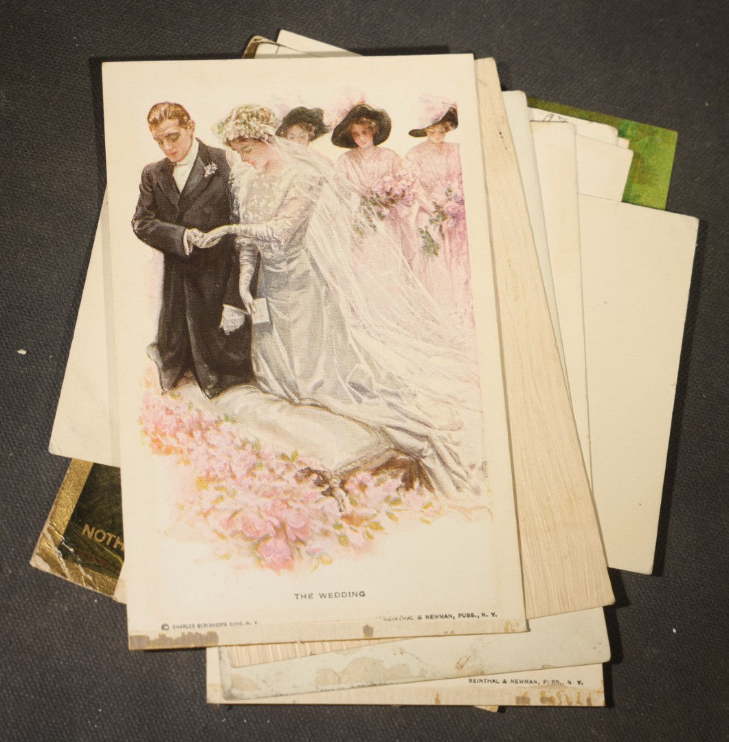 Grouping of approximately 15 Antique and Vintage Postcards including Girl with Dog, Romantic Couples, and Women's Portraits