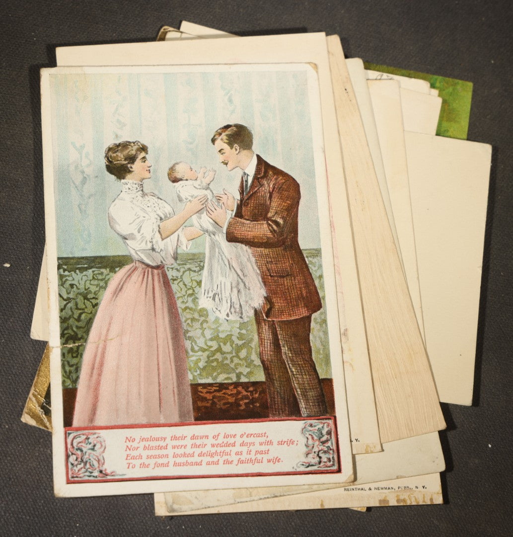 Grouping of approximately 15 Antique and Vintage Postcards including Girl with Dog, Romantic Couples, and Women's Portraits