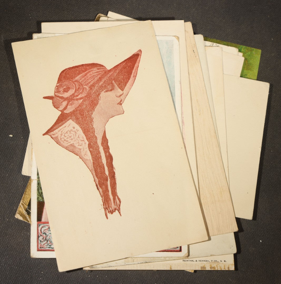 Grouping of approximately 15 Antique and Vintage Postcards including Girl with Dog, Romantic Couples, and Women's Portraits