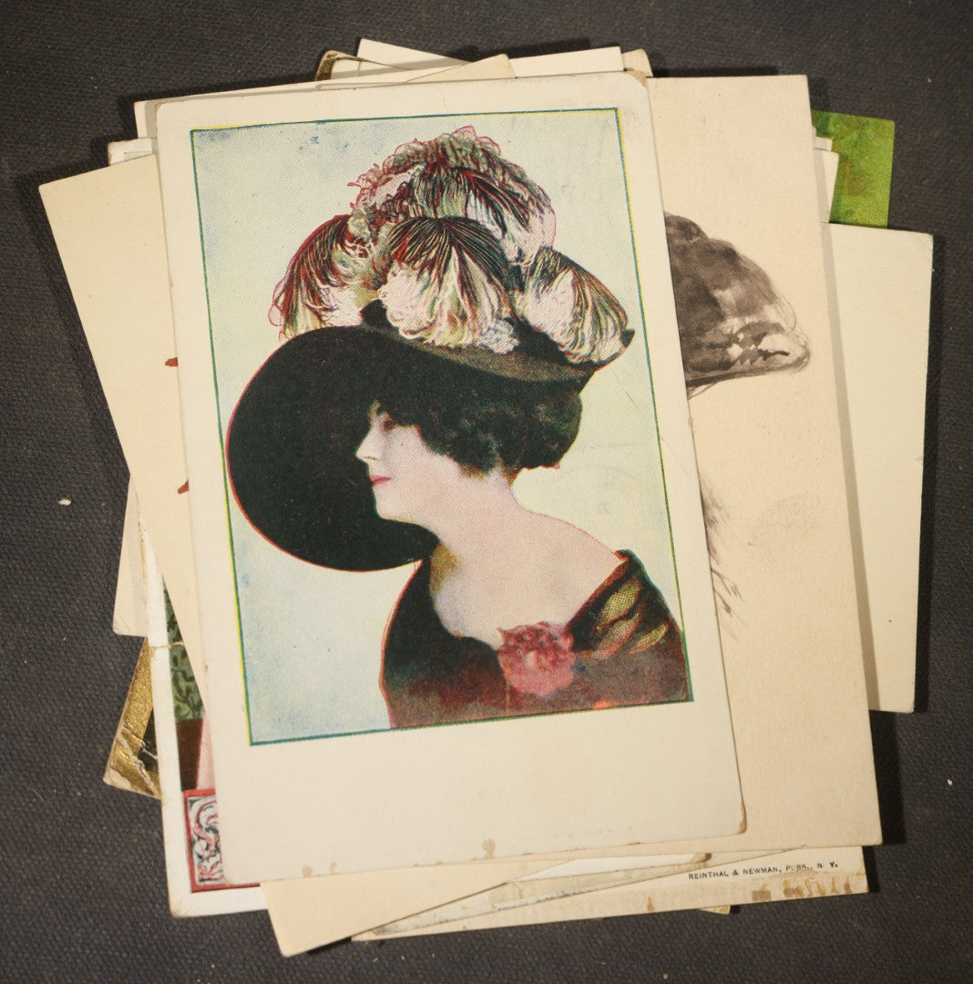 Grouping of approximately 15 Antique and Vintage Postcards including Girl with Dog, Romantic Couples, and Women's Portraits