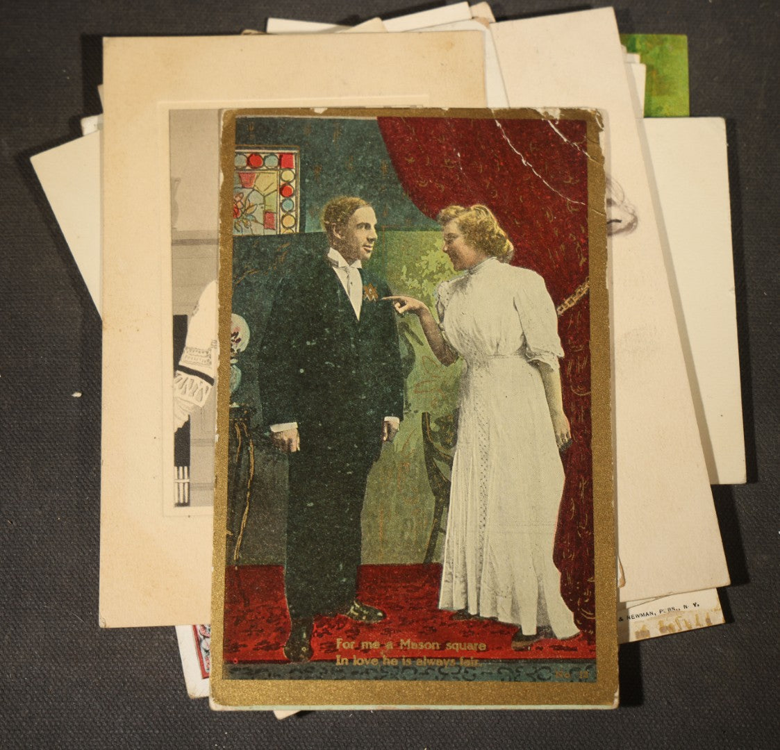 Grouping of approximately 15 Antique and Vintage Postcards including Girl with Dog, Romantic Couples, and Women's Portraits