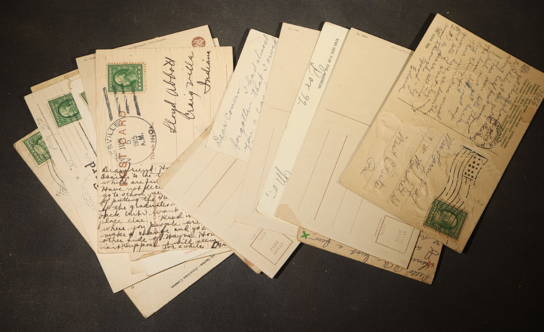 Grouping of approximately 15 Antique and Vintage Postcards including Girl with Dog, Romantic Couples, and Women's Portraits