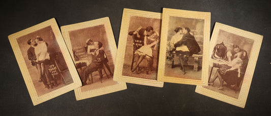 Grouping of Five Antique Embossed-Border Romantic Postcards with Photographic Vignettes of Couples including "I.O.U. A Kiss," "U.O.Me A Squeeze," and "It's There For You"