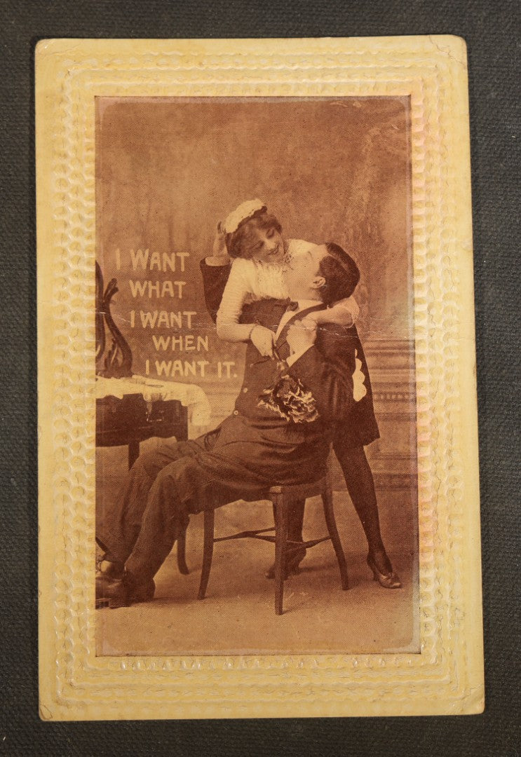 Grouping of Five Antique Embossed-Border Romantic Postcards with Photographic Vignettes of Couples including "I.O.U. A Kiss," "U.O.Me A Squeeze," and "It's There For You"