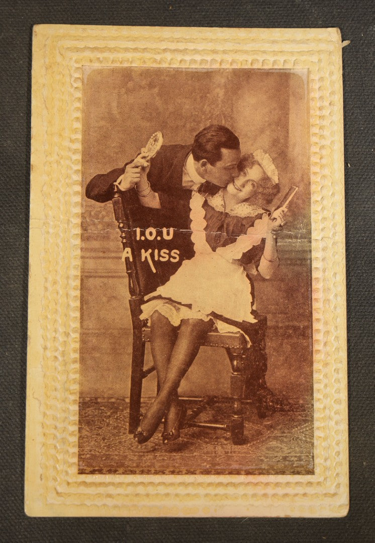Grouping of Five Antique Embossed-Border Romantic Postcards with Photographic Vignettes of Couples including "I.O.U. A Kiss," "U.O.Me A Squeeze," and "It's There For You"