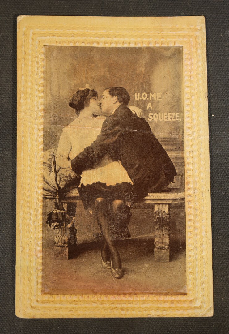 Grouping of Five Antique Embossed-Border Romantic Postcards with Photographic Vignettes of Couples including "I.O.U. A Kiss," "U.O.Me A Squeeze," and "It's There For You"