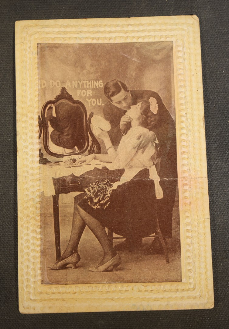 Grouping of Five Antique Embossed-Border Romantic Postcards with Photographic Vignettes of Couples including "I.O.U. A Kiss," "U.O.Me A Squeeze," and "It's There For You"