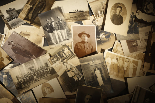 Grouping of approximately 40 Antique Real Photo Postcards R.P.P.C. including Military Soldier Portrait, Ocean Liner, Marching Band, and Portraits