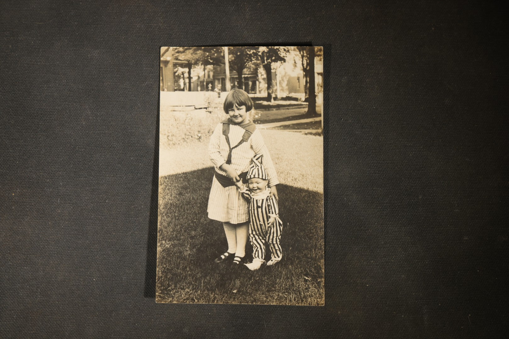 Grouping of approximately 40 Antique Real Photo Postcards R.P.P.C. including Military Soldier Portrait, Ocean Liner, Marching Band, and Portraits