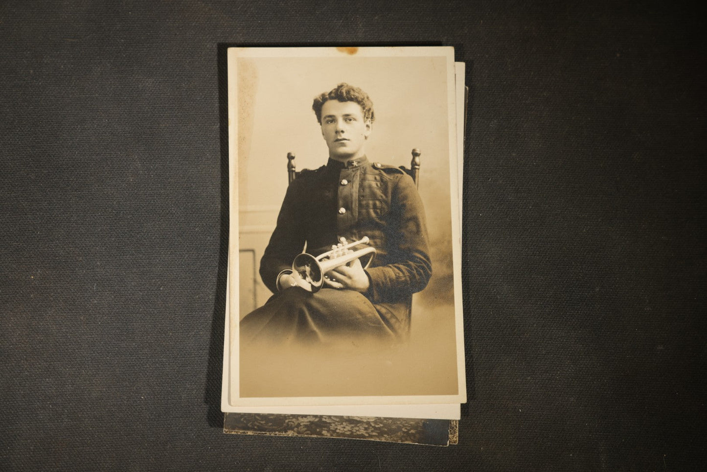 Grouping of approximately 40 Antique Real Photo Postcards R.P.P.C. including Military Soldier Portrait, Ocean Liner, Marching Band, and Portraits