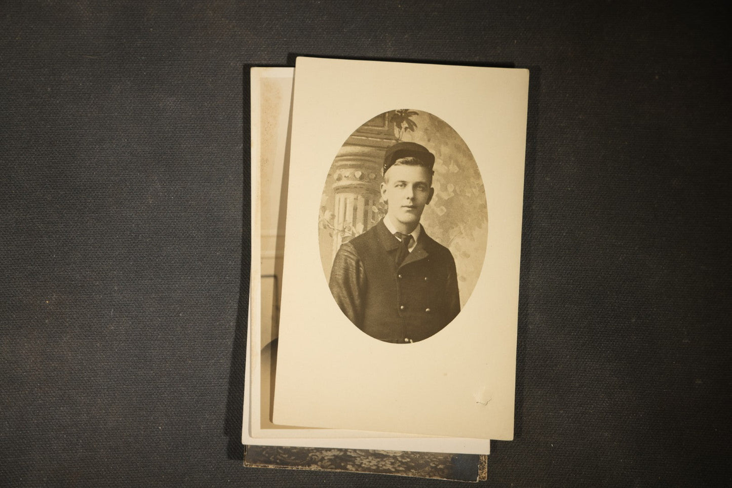 Grouping of approximately 40 Antique Real Photo Postcards R.P.P.C. including Military Soldier Portrait, Ocean Liner, Marching Band, and Portraits