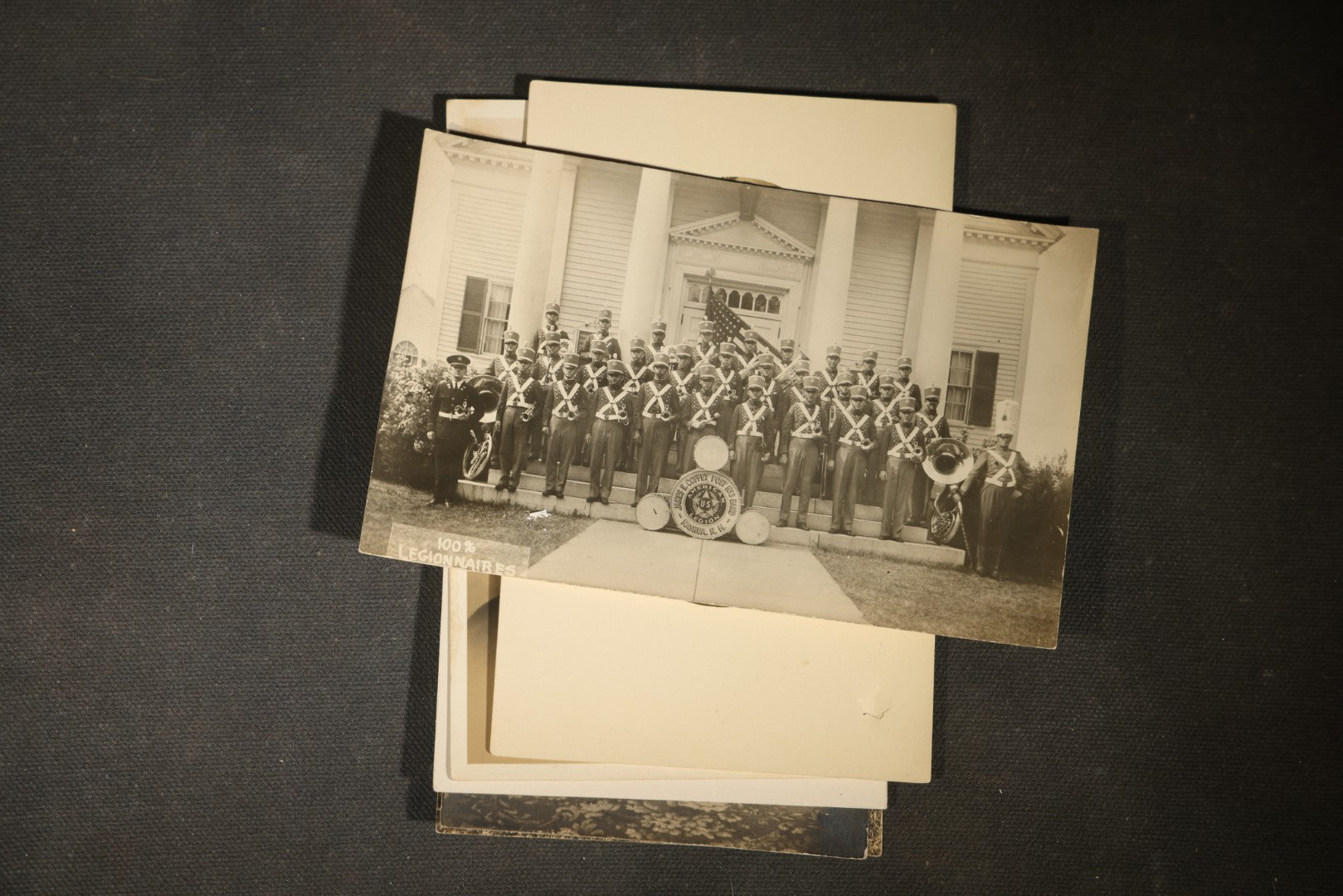 Grouping of approximately 40 Antique Real Photo Postcards R.P.P.C. including Military Soldier Portrait, Ocean Liner, Marching Band, and Portraits