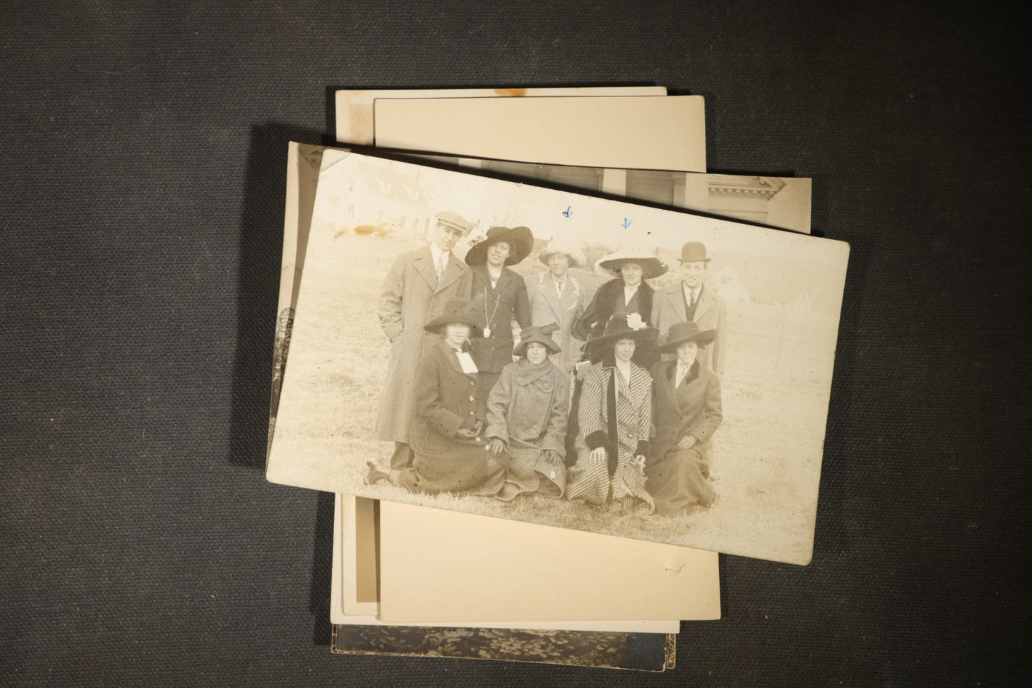 Grouping of approximately 40 Antique Real Photo Postcards R.P.P.C. including Military Soldier Portrait, Ocean Liner, Marching Band, and Portraits