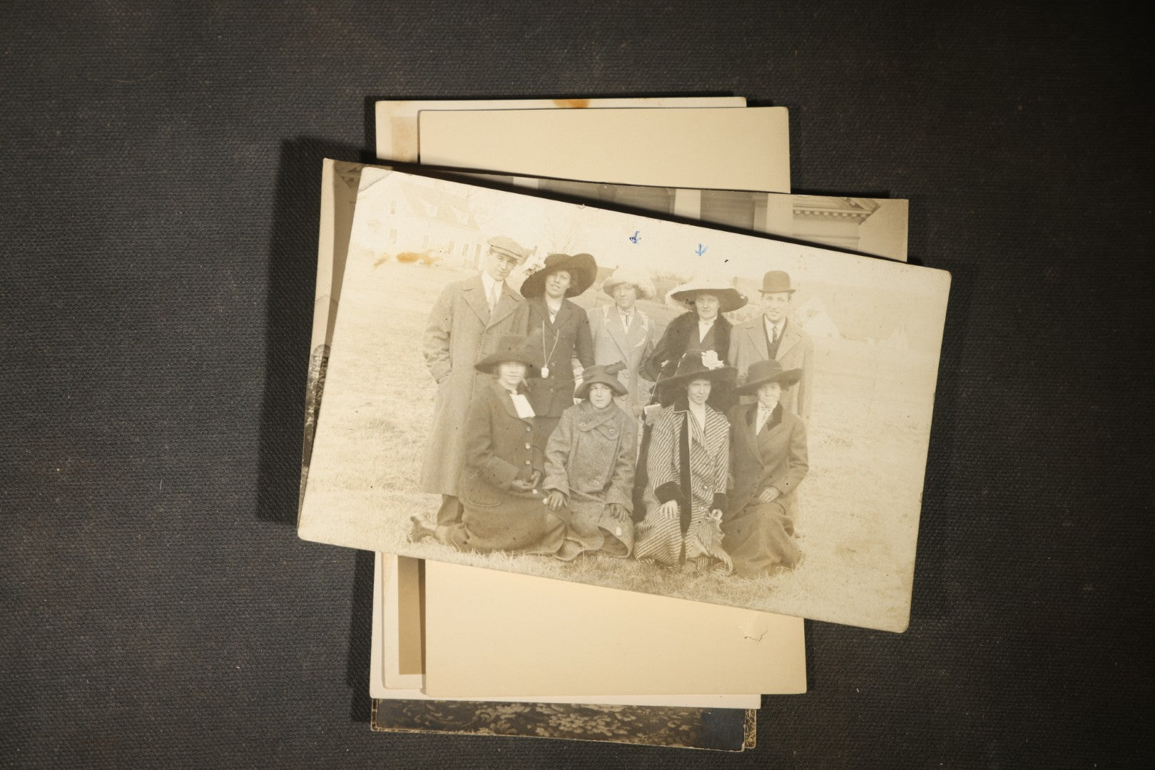 Grouping of approximately 40 Antique Real Photo Postcards R.P.P.C. including Military Soldier Portrait, Ocean Liner, Marching Band, and Portraits