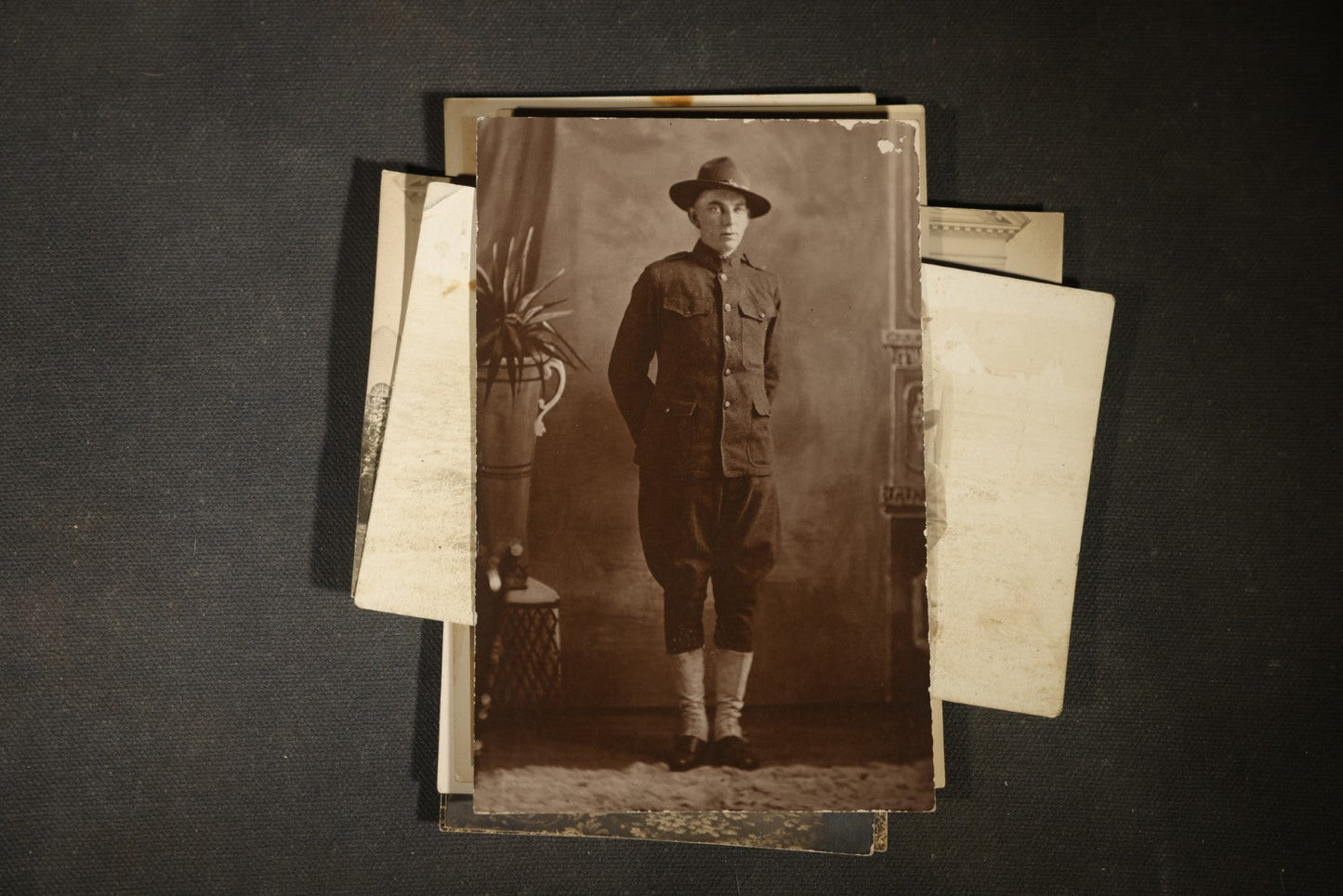 Grouping of approximately 40 Antique Real Photo Postcards R.P.P.C. including Military Soldier Portrait, Ocean Liner, Marching Band, and Portraits