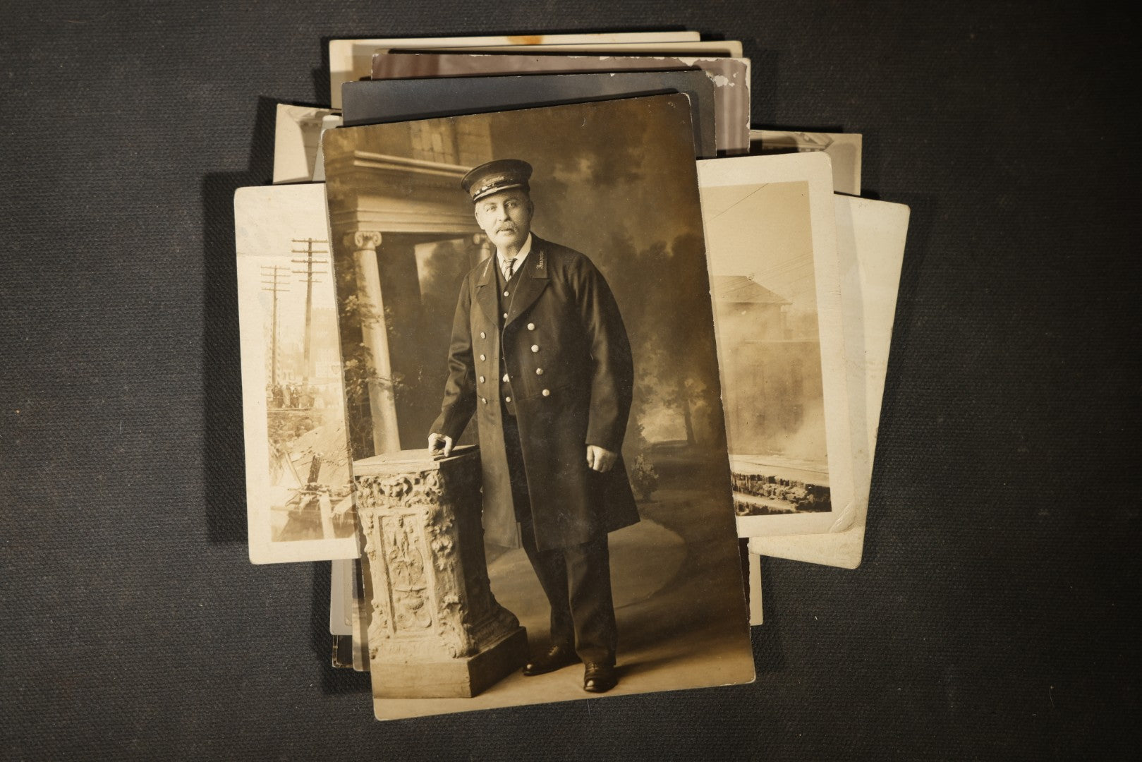 Grouping of approximately 40 Antique Real Photo Postcards R.P.P.C. including Military Soldier Portrait, Ocean Liner, Marching Band, and Portraits
