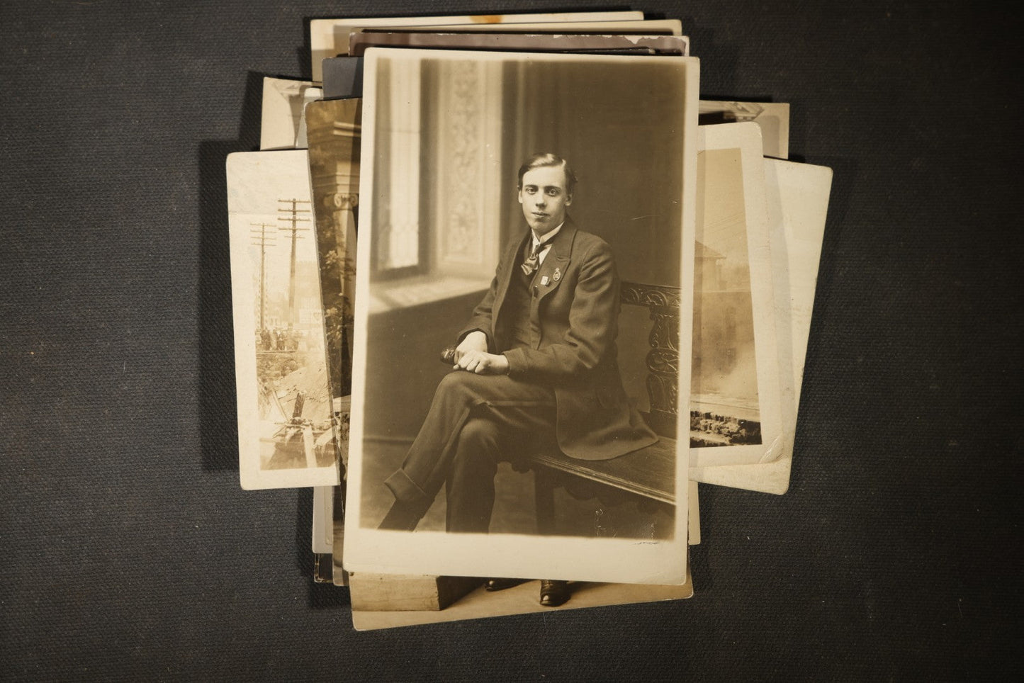 Grouping of approximately 40 Antique Real Photo Postcards R.P.P.C. including Military Soldier Portrait, Ocean Liner, Marching Band, and Portraits