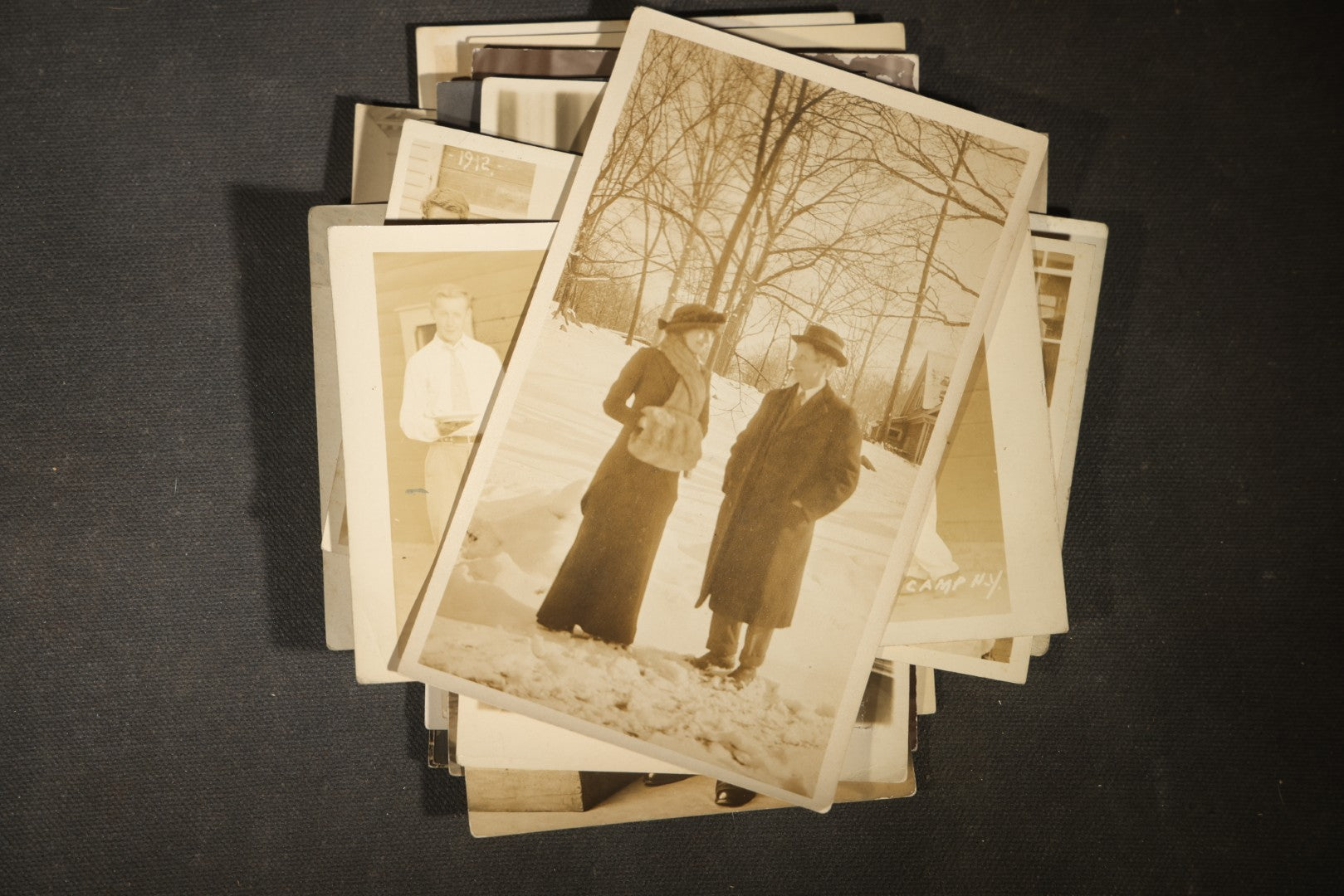 Grouping of approximately 40 Antique Real Photo Postcards R.P.P.C. including Military Soldier Portrait, Ocean Liner, Marching Band, and Portraits