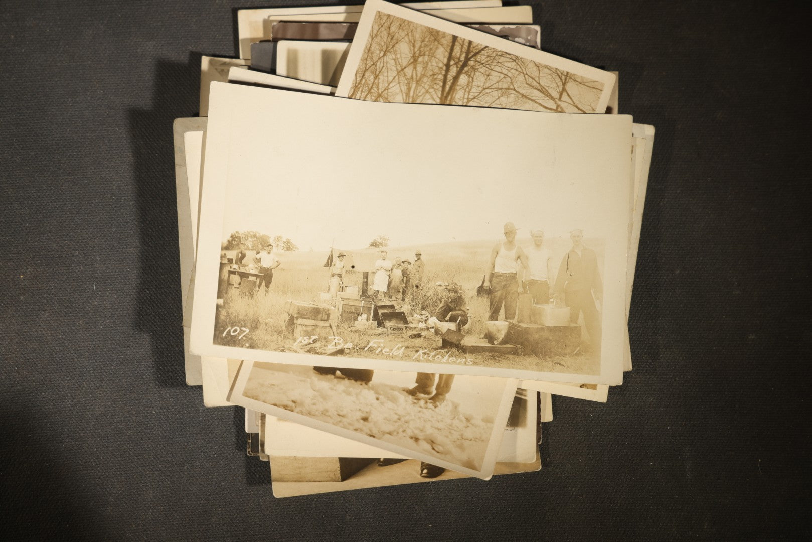 Grouping of approximately 40 Antique Real Photo Postcards R.P.P.C. including Military Soldier Portrait, Ocean Liner, Marching Band, and Portraits