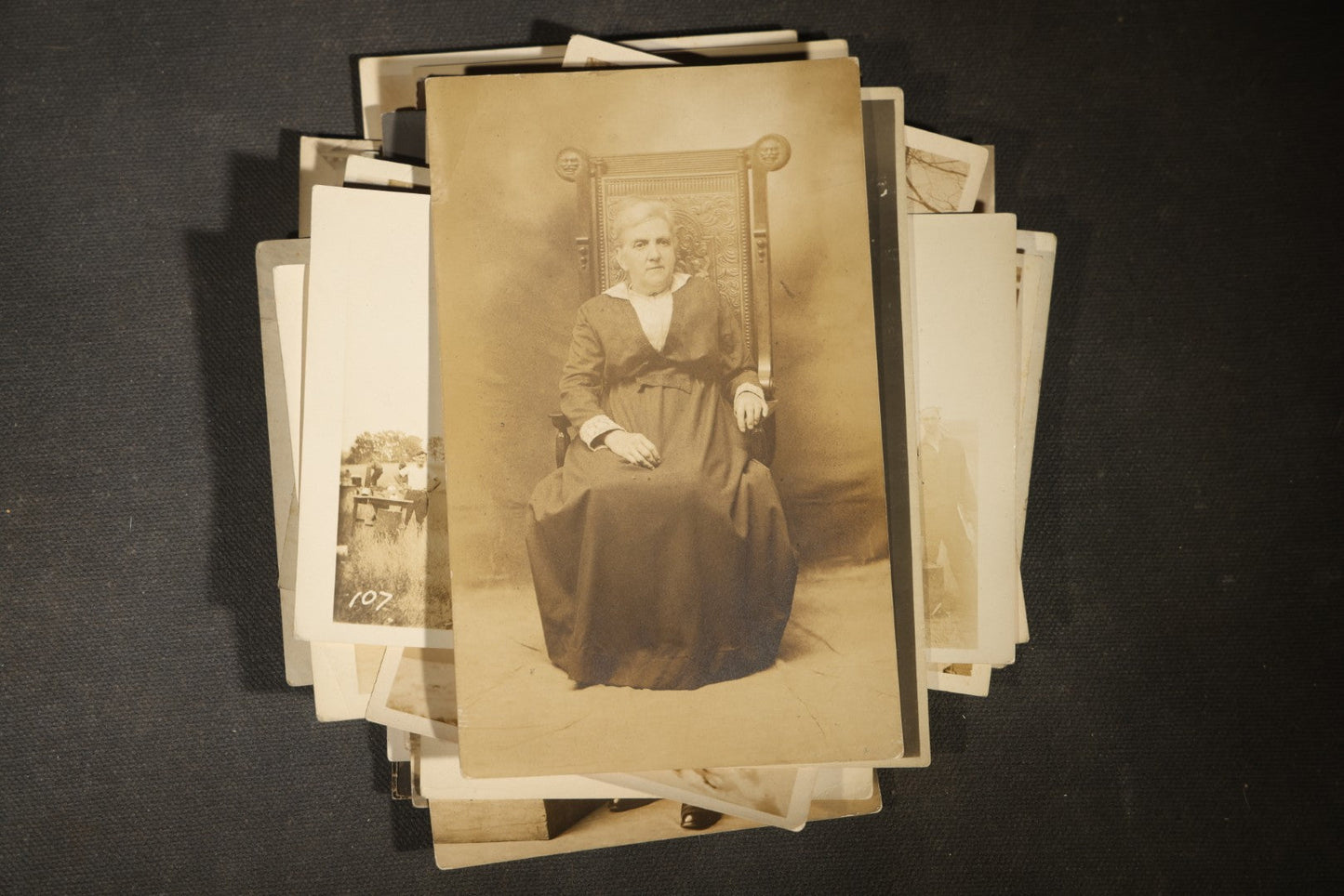 Grouping of approximately 40 Antique Real Photo Postcards R.P.P.C. including Military Soldier Portrait, Ocean Liner, Marching Band, and Portraits