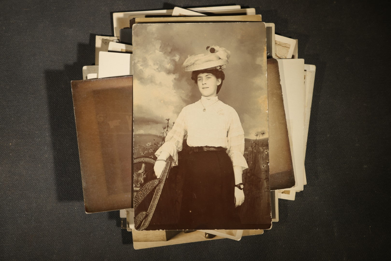 Grouping of approximately 40 Antique Real Photo Postcards R.P.P.C. including Military Soldier Portrait, Ocean Liner, Marching Band, and Portraits