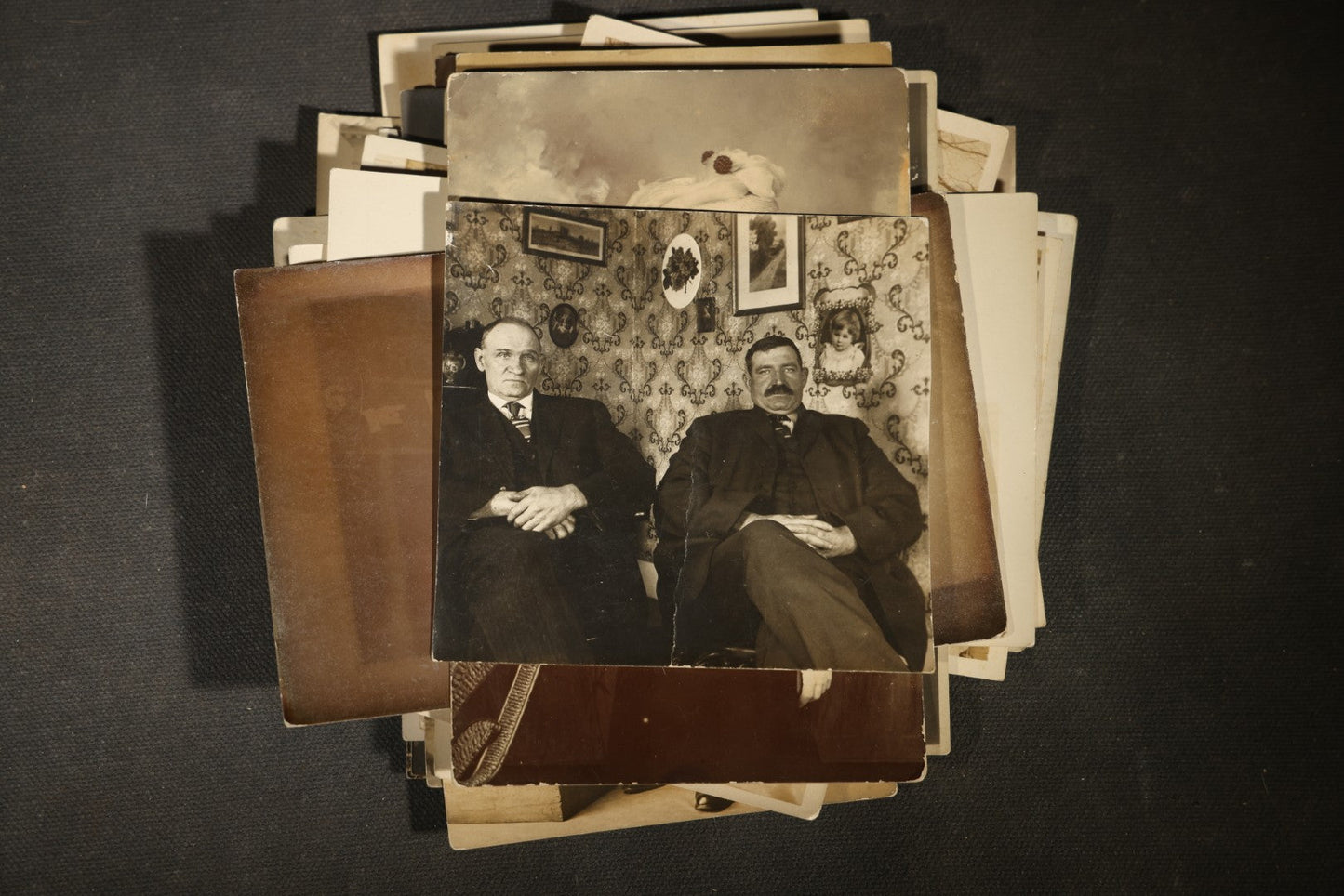 Grouping of approximately 40 Antique Real Photo Postcards R.P.P.C. including Military Soldier Portrait, Ocean Liner, Marching Band, and Portraits