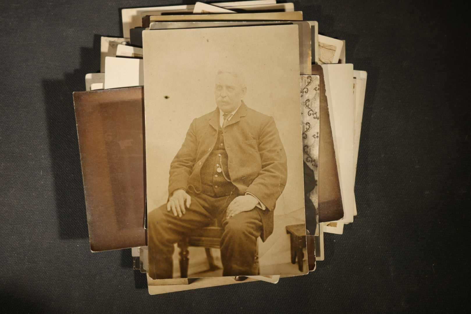 Grouping of approximately 40 Antique Real Photo Postcards R.P.P.C. including Military Soldier Portrait, Ocean Liner, Marching Band, and Portraits