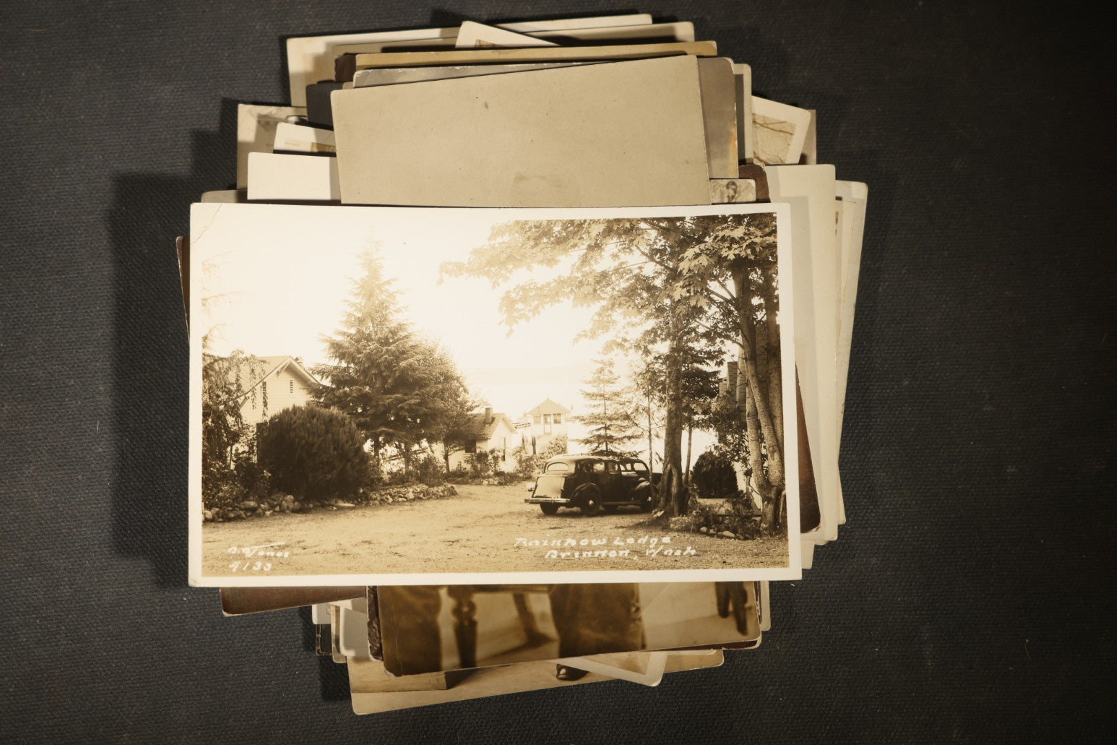 Grouping of approximately 40 Antique Real Photo Postcards R.P.P.C. including Military Soldier Portrait, Ocean Liner, Marching Band, and Portraits