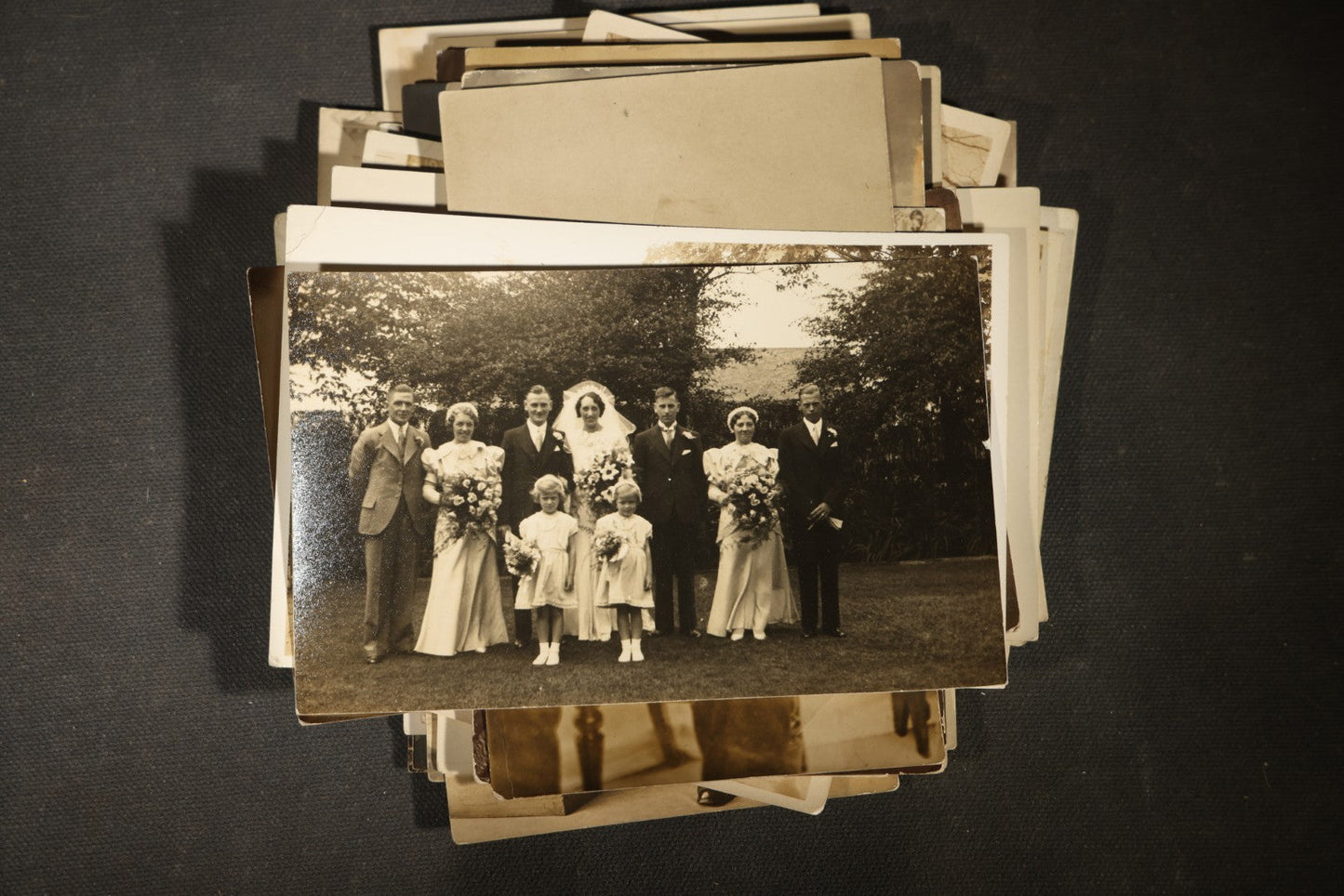 Grouping of approximately 40 Antique Real Photo Postcards R.P.P.C. including Military Soldier Portrait, Ocean Liner, Marching Band, and Portraits