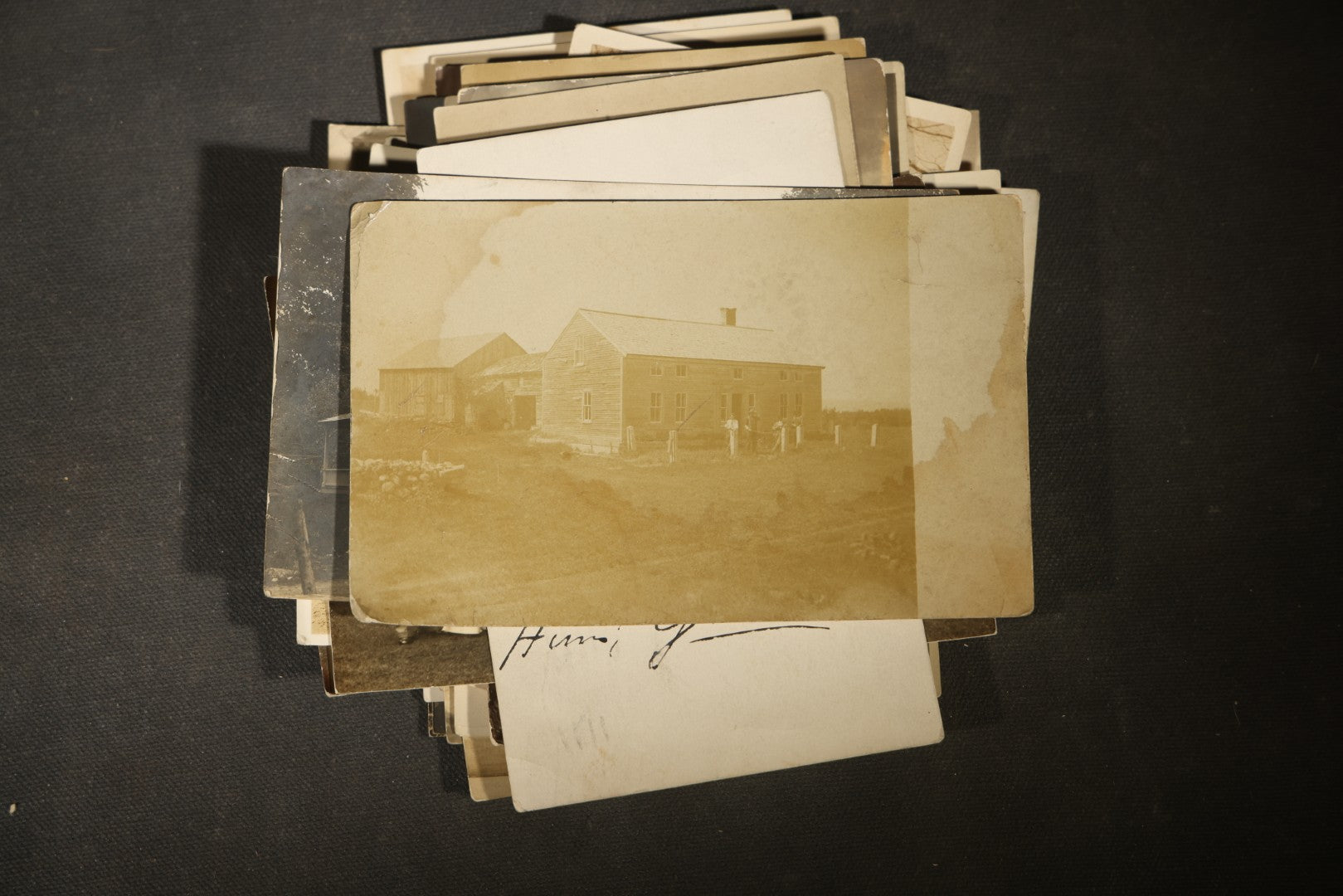 Grouping of approximately 40 Antique Real Photo Postcards R.P.P.C. including Military Soldier Portrait, Ocean Liner, Marching Band, and Portraits