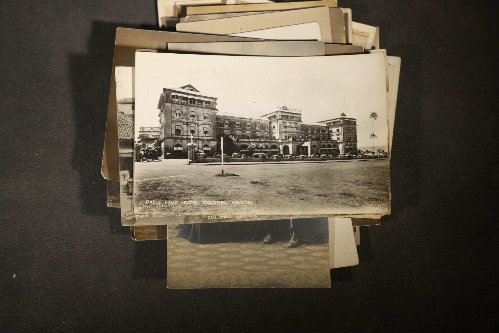 Grouping of approximately 40 Antique Real Photo Postcards R.P.P.C. including Military Soldier Portrait, Ocean Liner, Marching Band, and Portraits