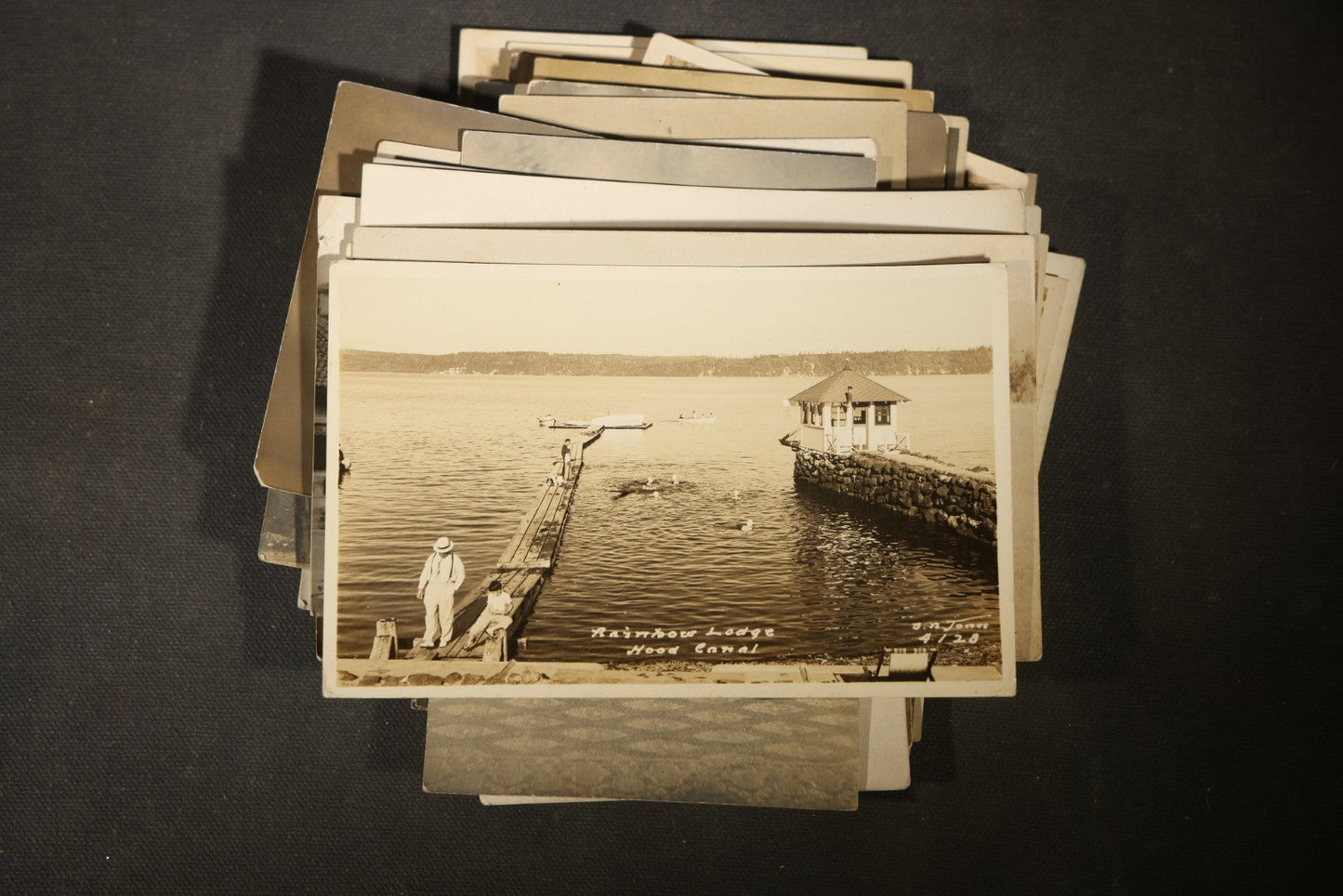 Grouping of approximately 40 Antique Real Photo Postcards R.P.P.C. including Military Soldier Portrait, Ocean Liner, Marching Band, and Portraits