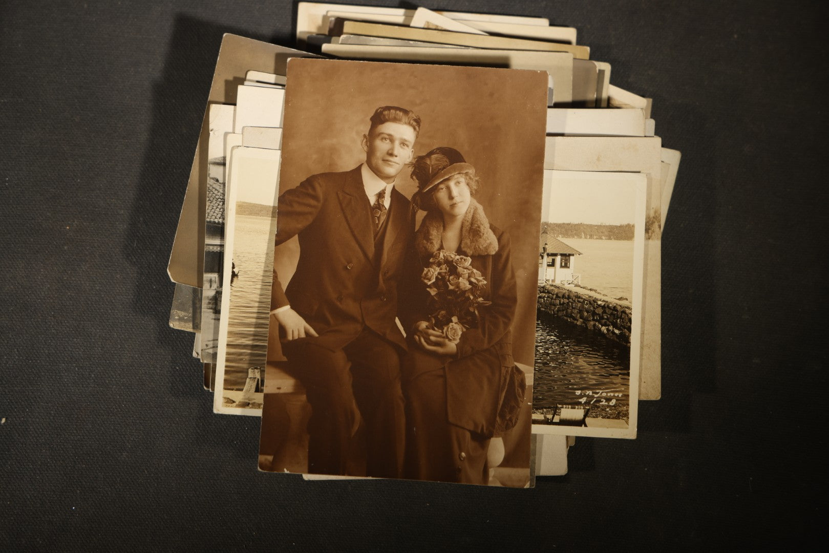 Grouping of approximately 40 Antique Real Photo Postcards R.P.P.C. including Military Soldier Portrait, Ocean Liner, Marching Band, and Portraits