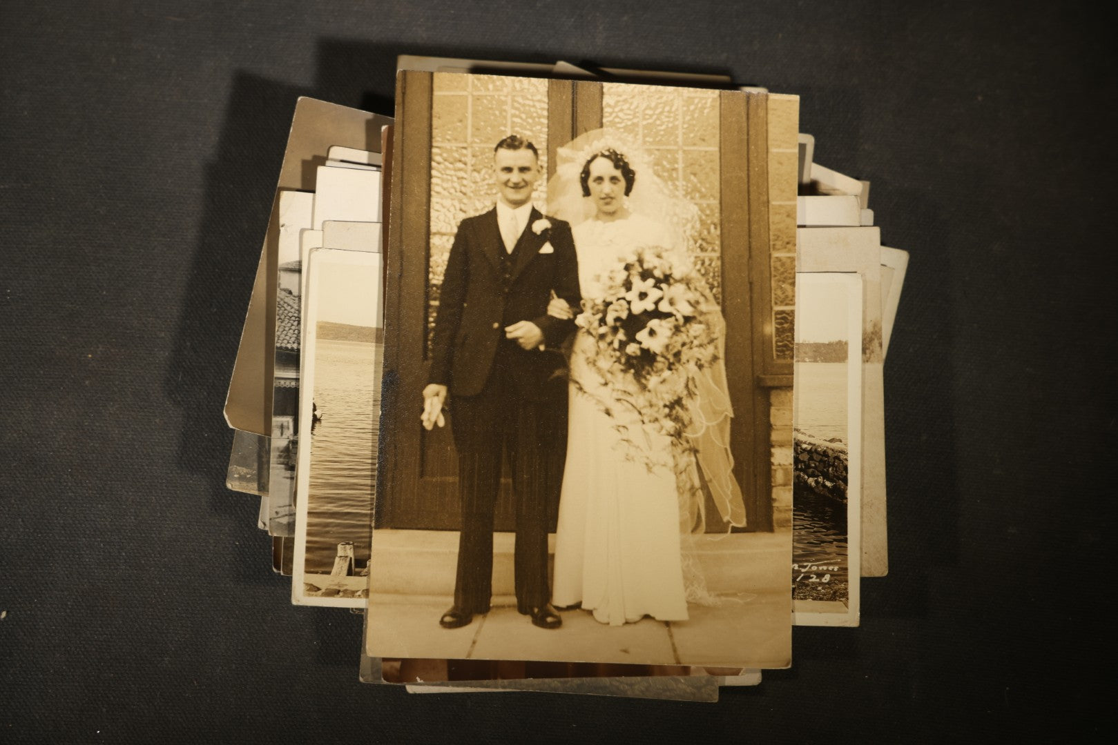 Grouping of approximately 40 Antique Real Photo Postcards R.P.P.C. including Military Soldier Portrait, Ocean Liner, Marching Band, and Portraits