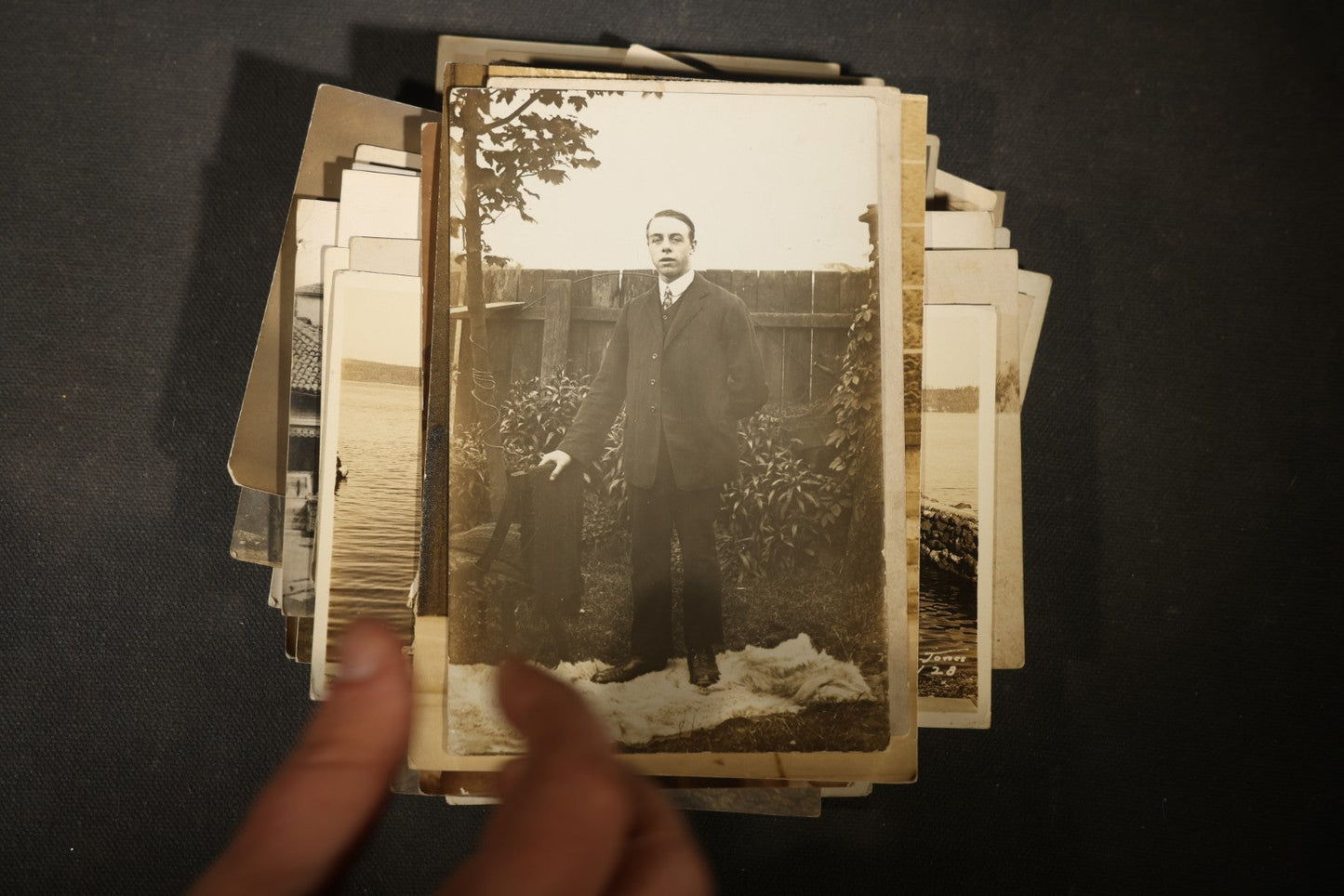 Grouping of approximately 40 Antique Real Photo Postcards R.P.P.C. including Military Soldier Portrait, Ocean Liner, Marching Band, and Portraits