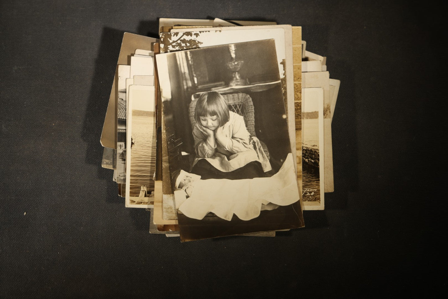Grouping of approximately 40 Antique Real Photo Postcards R.P.P.C. including Military Soldier Portrait, Ocean Liner, Marching Band, and Portraits