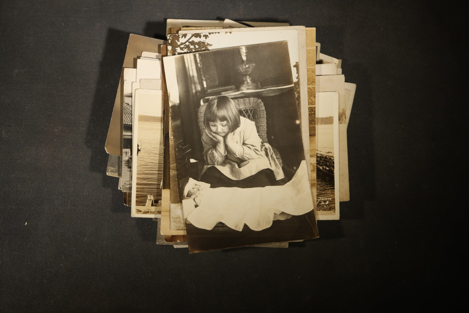 Grouping of approximately 40 Antique Real Photo Postcards R.P.P.C. including Military Soldier Portrait, Ocean Liner, Marching Band, and Portraits