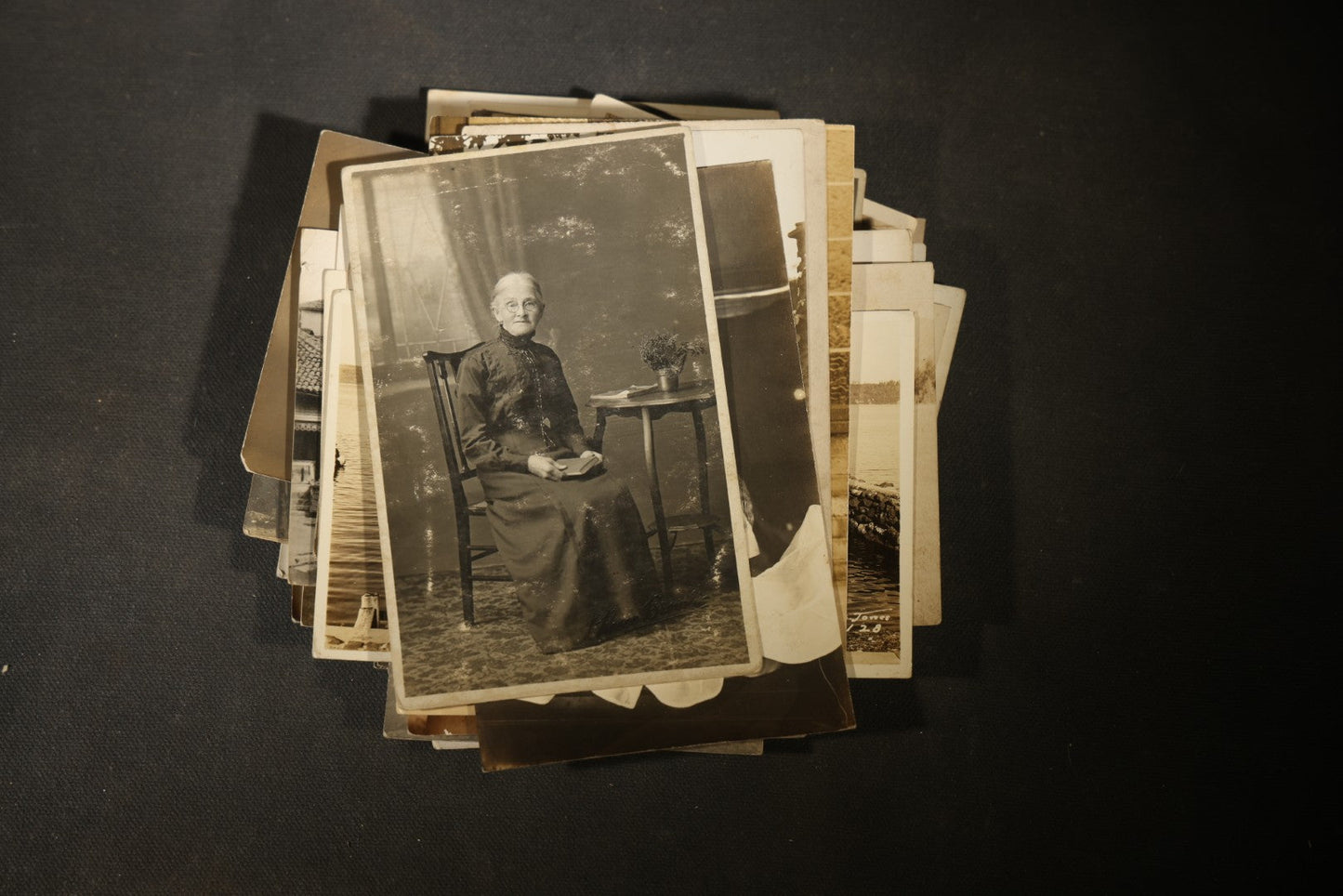 Grouping of approximately 40 Antique Real Photo Postcards R.P.P.C. including Military Soldier Portrait, Ocean Liner, Marching Band, and Portraits